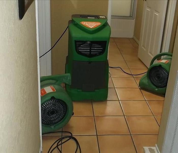 green equipment in hallway 