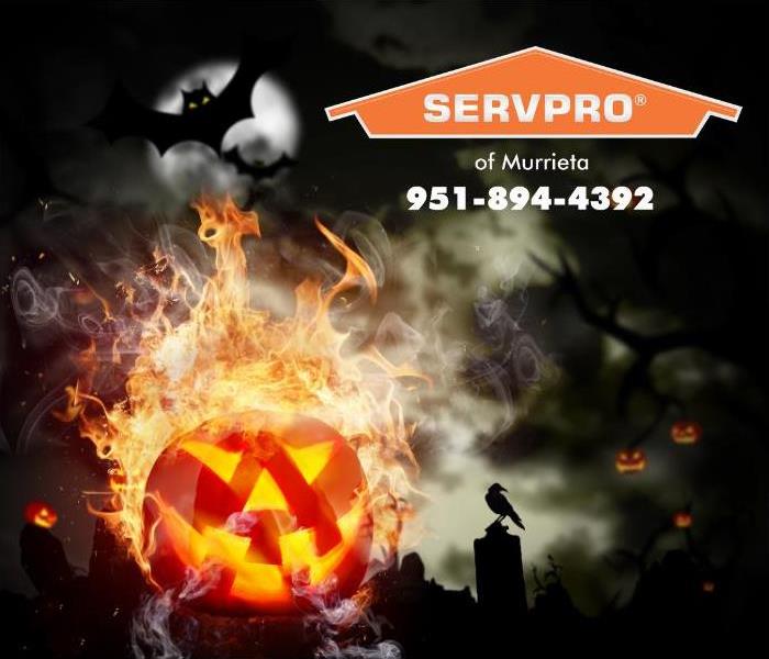 A pumpkin is shown bursting into flames of a dark Halloween night. 