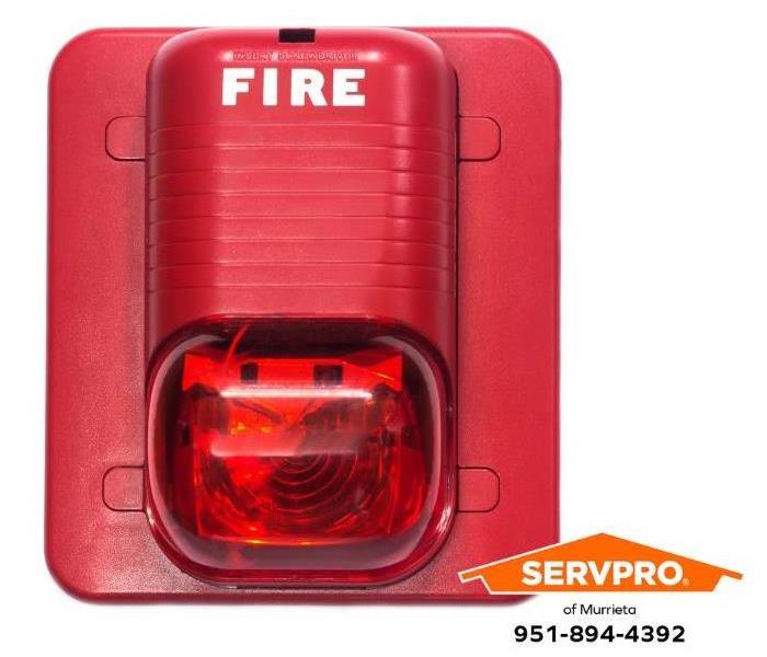 A fire alarm with a strobe light alerts hard-of-hearing and deaf people of impending fire danger.