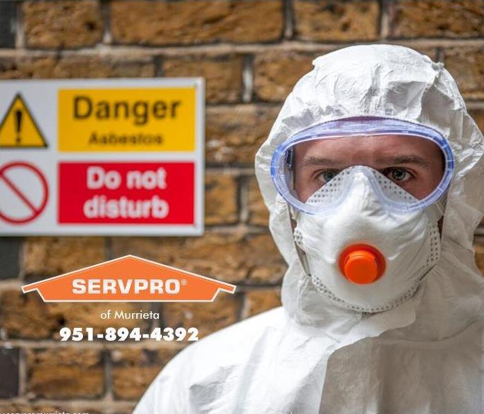 A SERVPRO technician is suited up in protective gear and face mask, ready to provide specialty cleaning services. 